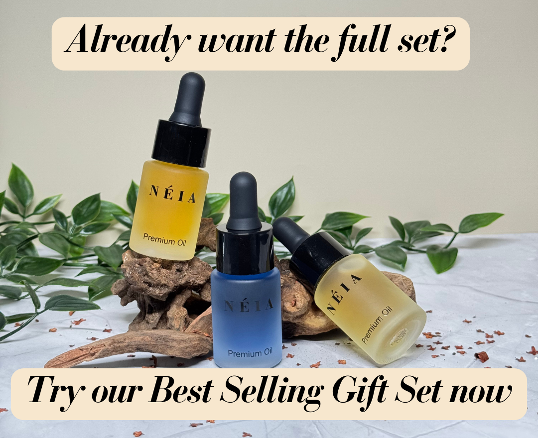 Three NÉIA skincare bottles with leaves and wood on a light background, promoting a gift set.