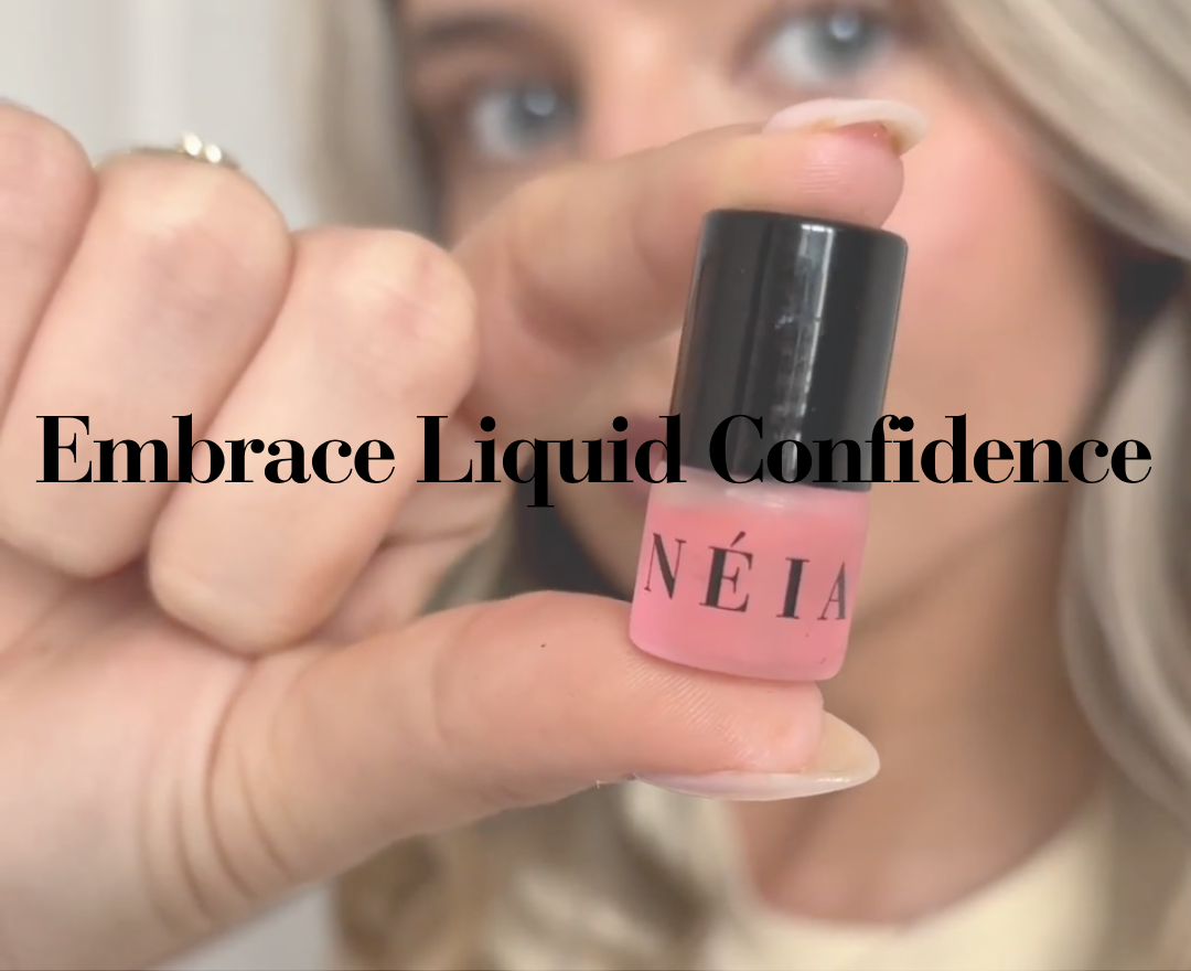 Hand holding a pink perfume oil bottle with 'NÉIA' branding and text 'Embrace Liquid Confidence'.