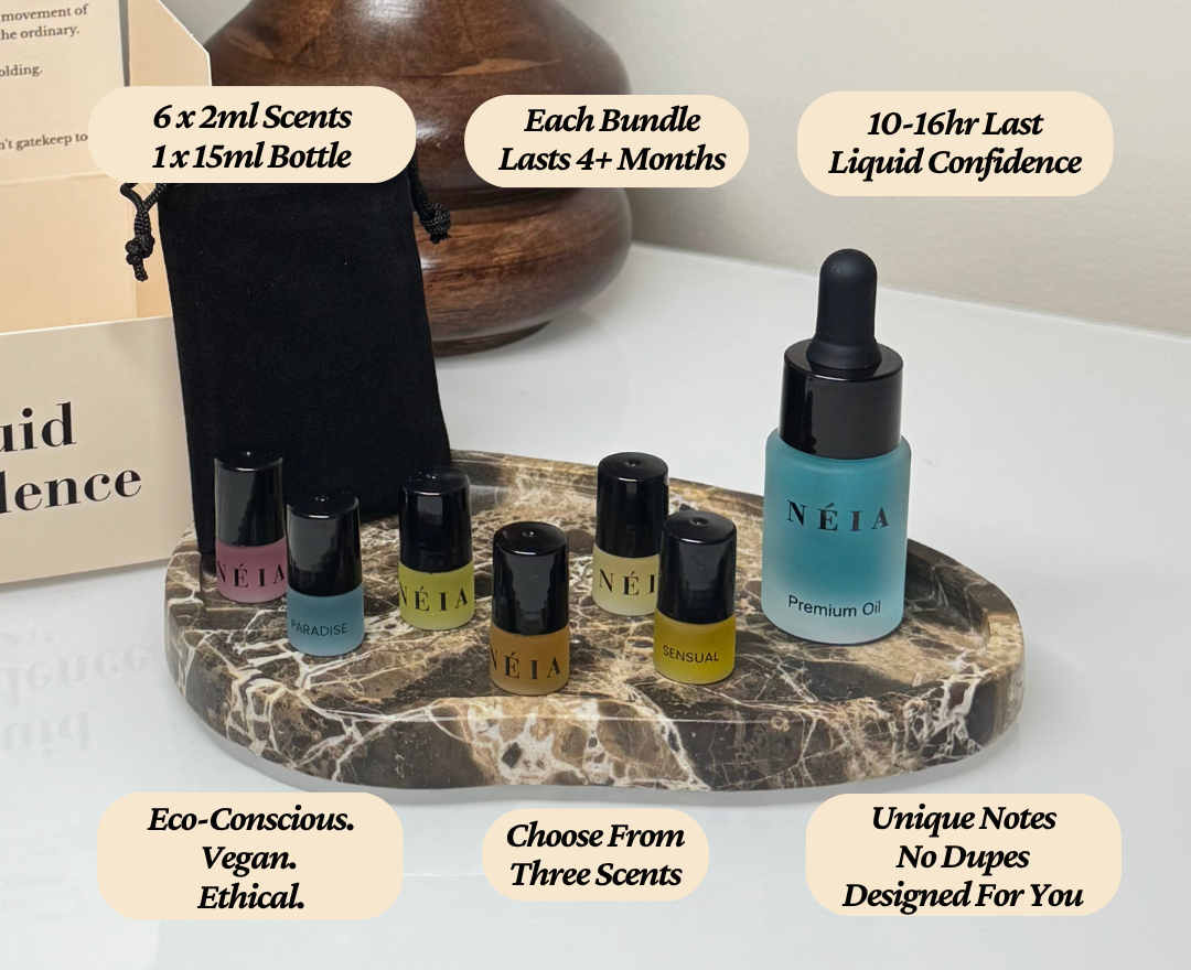 Set of NEIA premium oils on a marble tray with product details.