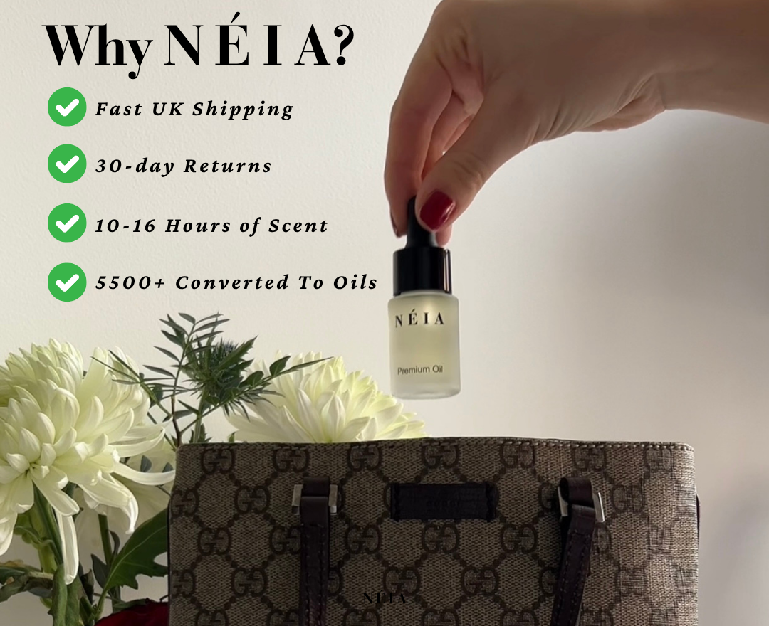 Néia perfume oil bottle with a hand holding it, flowers, and a handbag in the background.