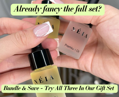 Three Néia perfume products held by a hand with text overlay.