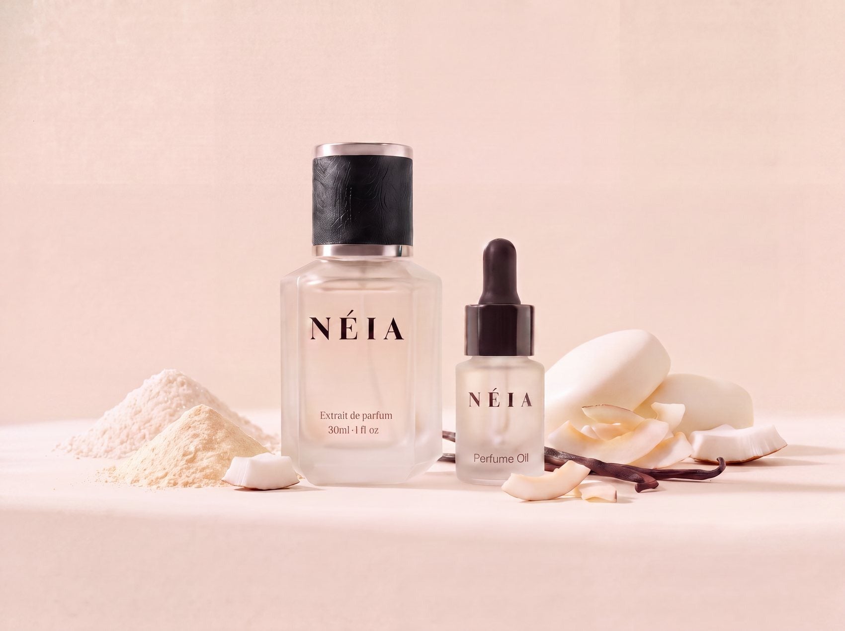 The Sexy Vanilla layering kit: the 30ml NÉIA Extrait de Parfum beside the 15ml Perfume Oil, with coconut powder, coconut flakes and vanilla pods.
